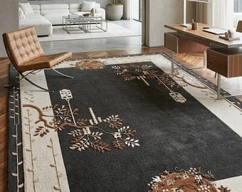 May include: A dark grey rectangular rug with a beige border and floral and branch designs in brown and white. The rug is in a modern living space with a leather chair and a desk.