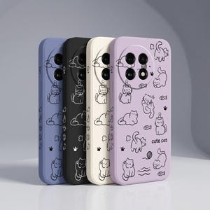 May include: Four rectangular phone cases in blue, black, cream, and light purple, each featuring a circular camera cutout and black line art illustrations of cats, fish, and yarn balls. The light purple case includes the text cute cat.