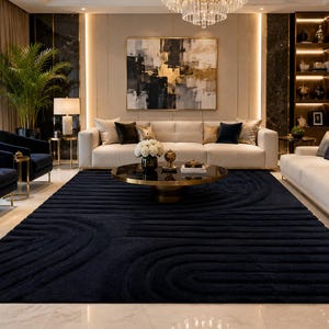 May include: A large rectangular area rug in a deep navy blue color featuring a raised, textured pattern of concentric semi-circular and linear geometric lines. The rug is positioned on a light-colored floor, providing a dark contrast to the room.