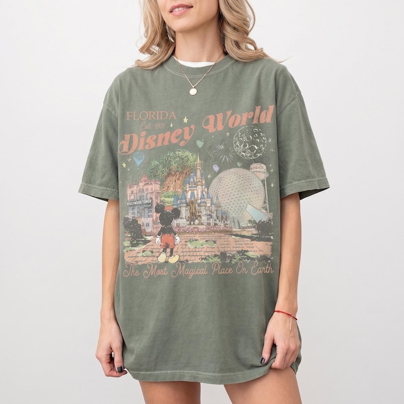 Comfort Colors Mickey Disneyworld shirt featuring a retro Mickey and Friends design. Perfect for your 2026 Disney trip or Disney vacation. Celebrate your magical experience with this stylish tee, ideal for family trips, group outings, and park days at Walt Disney World and Magic Kingdom. A must-have for Disney lovers! Mickey graphic tee for all ages.