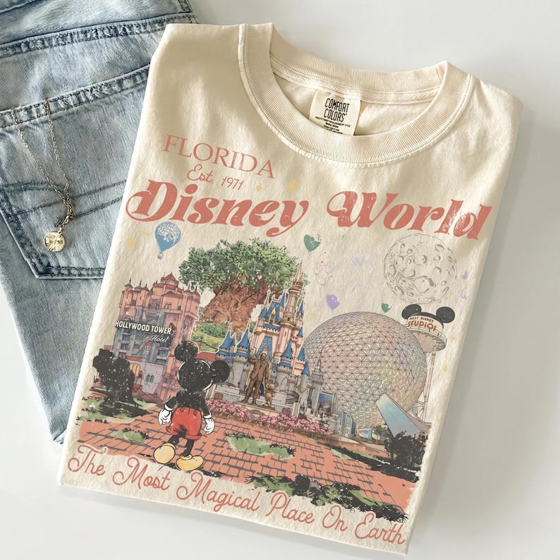 Comfort Colors Mickey Disneyworld shirt featuring a retro Mickey and Friends design. Perfect for your 2026 Disney trip or Disney vacation. Celebrate your magical experience with this stylish tee, ideal for family trips, group outings, and park days at Walt Disney World and Magic Kingdom. A must-have for Disney lovers! Mickey graphic tee for all ages.