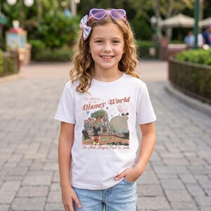 Comfort Colors Mickey Disneyworld shirt featuring a retro Mickey and Friends design. Perfect for your 2026 Disney trip or Disney vacation. Celebrate your magical experience with this stylish tee, ideal for family trips, group outings, and park days at Walt Disney World and Magic Kingdom. A must-have for Disney lovers! Mickey graphic tee for all ages.