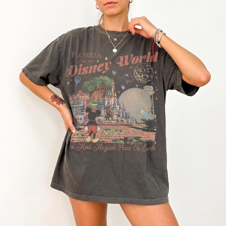 Comfort Colors Mickey Disneyworld shirt featuring a retro Mickey and Friends design. Perfect for your 2026 Disney trip or Disney vacation. Celebrate your magical experience with this stylish tee, ideal for family trips, group outings, and park days at Walt Disney World and Magic Kingdom. A must-have for Disney lovers! Mickey graphic tee for all ages.