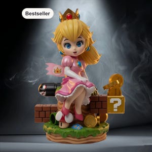 Op de afbeelding: Een beeldje van Princess Peach uit de Super Mario-videogameserie. Ze draagt een roze jurk en kroon, zittend op een bakstenen platform met een Bullet Bill, een vraagtekenblok en munten. Het woord "Bestseller" staat linksboven.