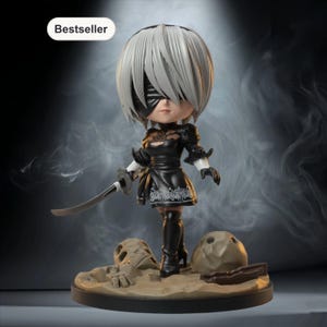 May include: A figurine of a character with white hair, a black blindfold, and a black dress, holding a sword. The figurine is on a base with a desert scene and the word "Bestseller" is in a white oval.