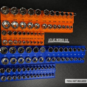 May include: A collection of sockets arranged in orange and blue holders. The sizes are clearly marked in inches. The image also displays the text "ATLAS WORKS CO." and "TOOLS NOT INCLUDED".