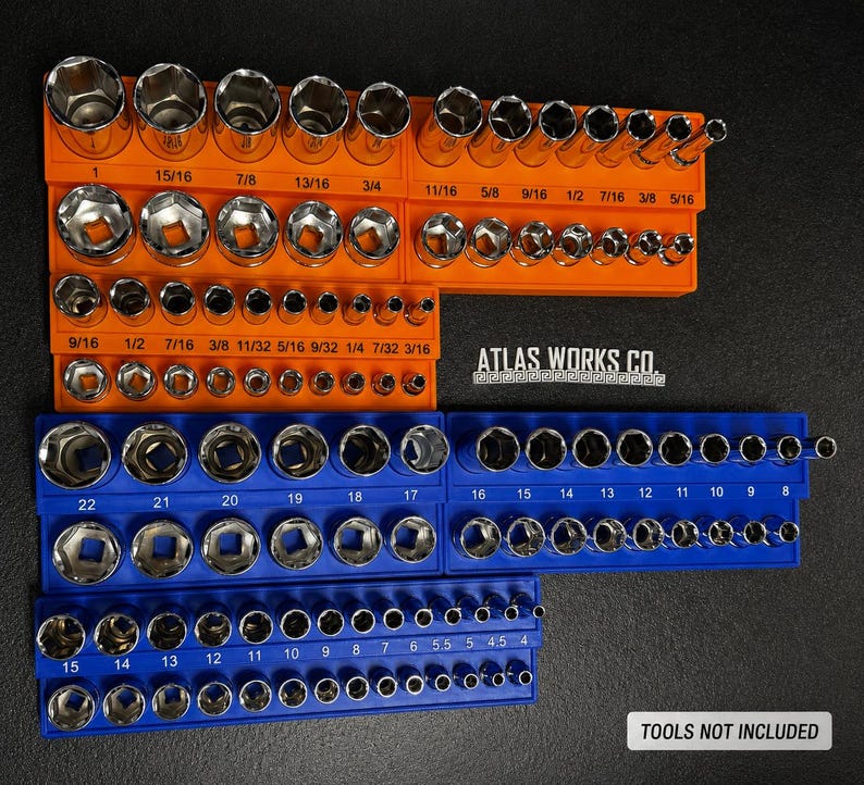 May include: A collection of sockets arranged in orange and blue holders. The sizes are clearly marked in inches. The image also displays the text "ATLAS WORKS CO." and "TOOLS NOT INCLUDED".