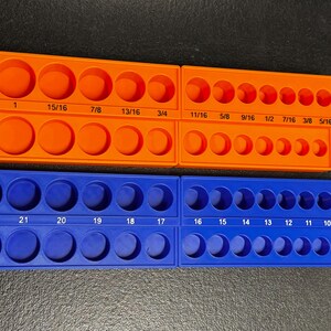 May include: Two socket organisers, one orange and one blue. The orange organiser has sizes from 1 inch to 5/16 inch. The blue organiser has sizes from 8 to 22. Each organiser has two rows of sockets.