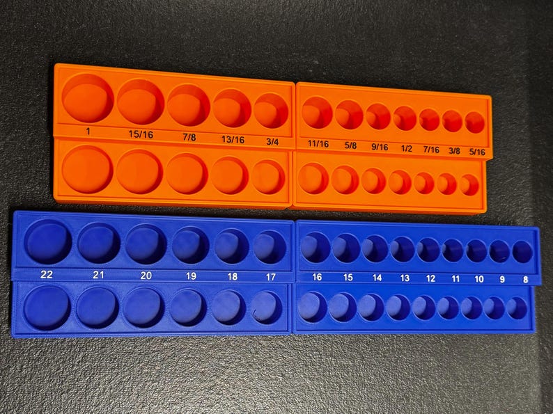 May include: Two socket organisers, one orange and one blue. The orange organiser has sizes from 1 inch to 5/16 inch. The blue organiser has sizes from 8 to 22. Each organiser has two rows of sockets.