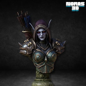 Puede incluir: Busto detallado de un personaje de fantasía con piel pálida, ojos rojos y una capa con capucha. La figura lleva una armadura ornamentada con detalles de calaveras y sostiene una aljaba de flechas. El busto está montado sobre una base de piedra, con el texto "NORAS 3D".