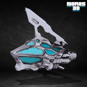 May include: A futuristic, geometric spacecraft model in shades of gray and white, featuring teal-colored windows. The design includes a large, angled fin and the text "NORAS 3D" in teal.