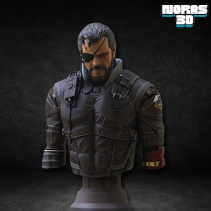 May include: A detailed bust of a character with an eyepatch, beard, and military-style attire. The figure is predominantly dark grey with red and gold accents on the right arm. The bust is mounted on a grey pedestal, with the text "NORAS 3D" in turquoise.