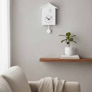 May include: A set of three ceramic mugs with a speckled, matte finish. The mugs are in shades of cream, light gray, and dark gray. Each mug has a simple, minimalist design, perfect for coffee or tea.