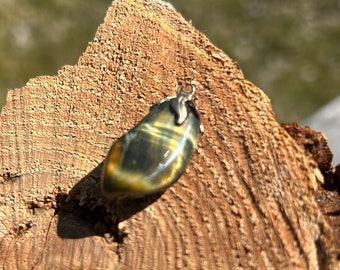 Tiger’s eye charm pendant polished stone precious stone gemstone