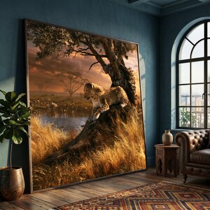 May include: A large rectangular wall art print featuring a leopard resting on a tree trunk overlooking a savanna landscape at sunset. The scene includes golden tall grasses, a calm body of water, and distant acacia trees under a warm orange sky.