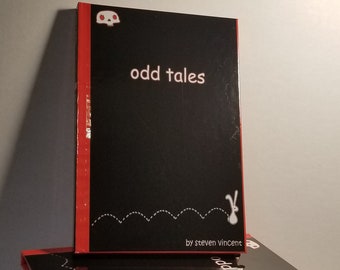 Odd Tales anthology. 144 pages of cute yet macabre illustrated stories. Hardcover signed with a sketch.