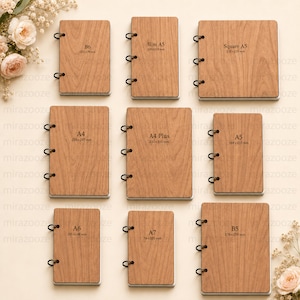 May include: Nine wooden notebooks arranged in a grid, each featuring black metal ring bindings and printed size labels including B6 125x176mm, Slim A5 130x210mm, Square A5 210x210mm, A4 210x297mm, A4 Plus 230x310mm, A5 148x210mm, A6 105x148mm, A7 74x105mm, and B5 176x250mm.