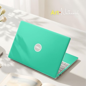 May include: A bright turquoise laptop skin applied to a Dell laptop, featuring a smooth matte finish and the white Dell logo centered on the lid. The text Art-Nathaniel is visible in the upper right corner, accompanied by white flowers.