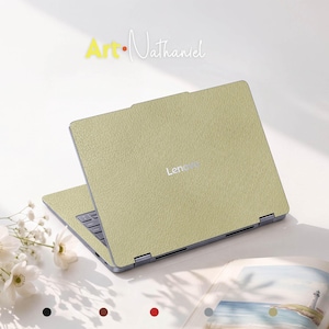 May include: A Lenovo laptop featuring a textured, light olive green skin covering the exterior lid and keyboard deck. The brand name Lenovo is centered on the lid. The text Art-Nathaniel appears above the laptop, and five small colored circles are visible at the bottom.