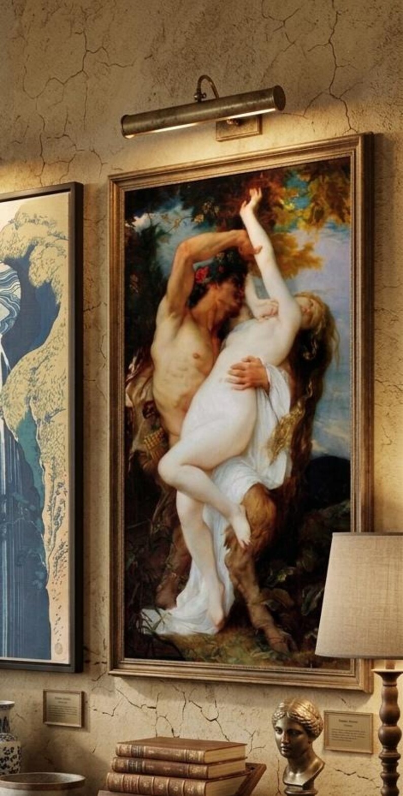 May include: A framed oil painting depicting a mythological scene with a satyr figure holding a pale, draped figure in a forest setting. The artwork features rich earth tones, deep greens, and soft highlights, encased in a simple gold-toned frame.