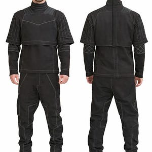 May include: A black outfit comprising a long-sleeved top and trousers. The top features a high collar and a cape-like overlay, with white stitching details. The trousers have matching stitching. The outfit is shown from the front and back.