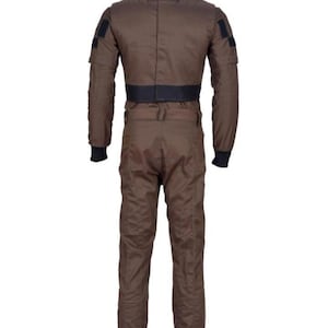 May include: A brown jumpsuit with a high collar and black accents. The one-piece garment features a black belt at the waist, black cuffs, and patches on the upper arms. The back view shows the full length of the suit.