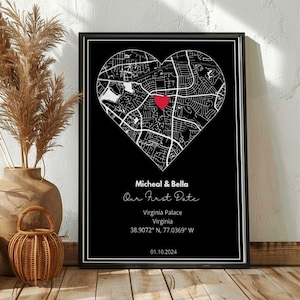 May include: A framed black and white map print in a heart shape, with a red heart marking a location. The print includes the text "Micheal & Bella Our First Date" and location details: Virginia Palace, Virginia, and coordinates. The date 01.10.2024 is also displayed.