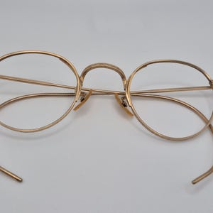 May include: A rustic wooden sign with the text "Welcome to our home" in white lettering. The sign features a distressed finish and a simple, inviting design, perfect for entryway decor.