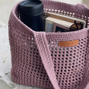 May include: A set of three ceramic mugs with a speckled, matte finish. The mugs are in shades of cream, light gray, and dark gray. Each mug has a simple, minimalist design, perfect for coffee or tea.