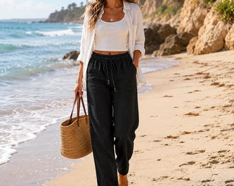Pantaloni a gamba dritta in 100% lino, neri, taglia M, con coulisse lunga e elastico in vita.