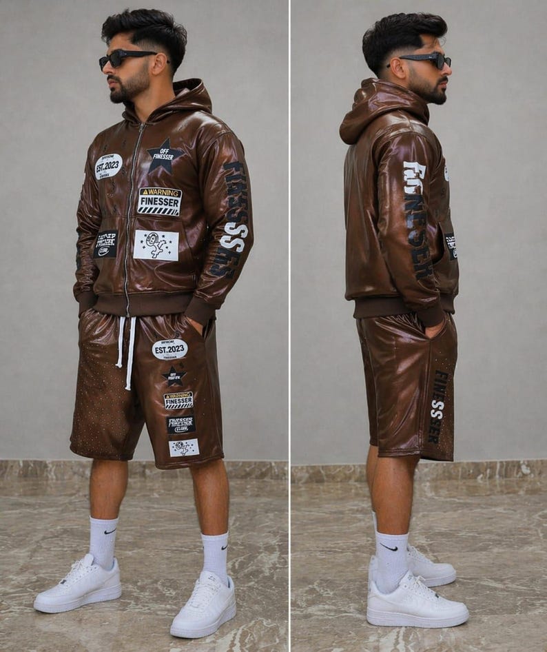 May include: A brown faux leather hoodie and shorts set. The jacket has multiple patches and the text "FINESSER" on the sleeve. The shorts also have patches and the text "FINESSER" on the leg. The set is worn with white trainers and socks.