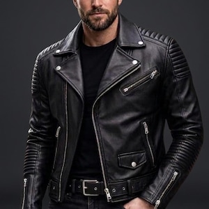 May include: A black leather motorcycle jacket featuring a notched lapel, silver-tone metal zips, and snap-button closures. The jacket includes quilted shoulder and sleeve detailing, a waist belt with a metal buckle, and a black t-shirt underneath.