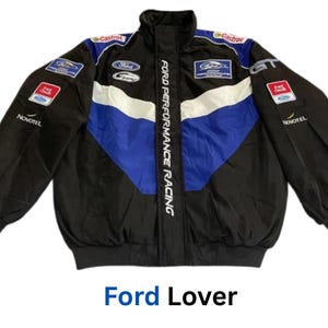 May include: Black, blue, and white Ford Performance Racing jacket. The jacket features a stand-up collar, multiple sponsor logos, and the text "Ford Performance Racing" down the front. The bottom of the jacket has a black elastic band. The text "Ford Lover" is at the bottom.