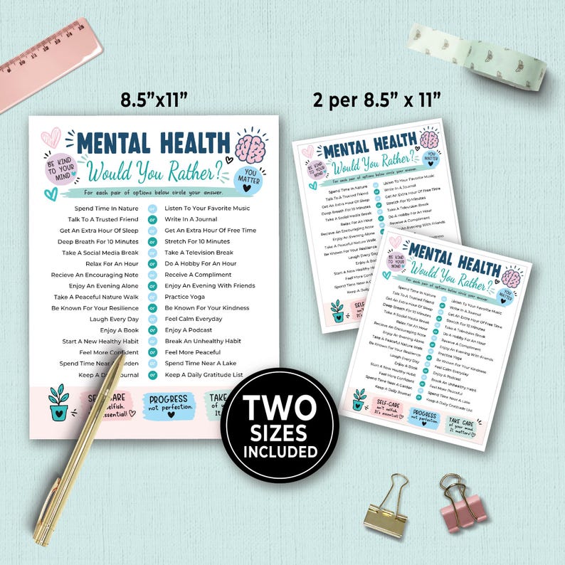 May include: A Mental Health Would You Rather game sheet set featuring two sizes, 8.5"x11" and 2 per 8.5"x11". The white paper includes blue and pink text, a brain illustration, and self-care prompts. A gold pen, two binder clips, a ruler, and tape are visible.