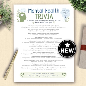 May include: A printed mental health trivia game sheet with questions and answers. The title "Mental Health Trivia" is at the top, with the words "It's okay not to be okay" in the upper right corner. A "NEW" sticker is on the bottom right.