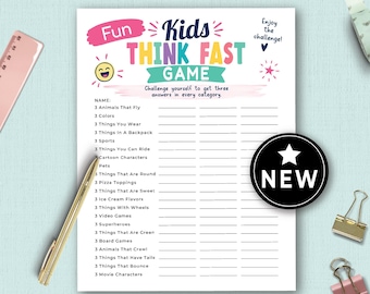 May include: A white game sheet titled Fun Kids THINK FAST GAME with colorful text and a list of categories to fill in. The sheet includes a black circular NEW badge with a white star, a gold pen, a pink ruler, and two metal binder clips.