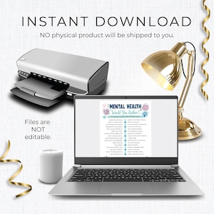 May include: A digital mental health game titled Mental Health Would You Rather displayed on a laptop screen. The image includes a printer, a gold desk lamp, and a white candle. Text on the screen lists various self-care activities and prompts.