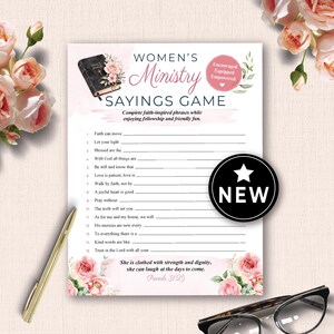 May include: A Women's Ministry Sayings Game, featuring a floral design and the word "NEW" on a black circle. The game includes faith-inspired phrases and is designed for fellowship and fun. A pen and glasses are in the image.