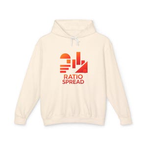 May include: Cream-colored hoodie with a drawstring and a graphic on the front. The graphic features a geometric design in shades of orange and red, with the words "RATIO SPREAD" in red below the design.