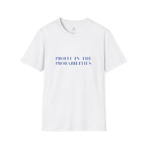 May include: White t-shirt with the text "PROFIT IN THE PROBABILITIES" in blue. The shirt has a crew neck and short sleeves. A small logo is visible near the neckline.