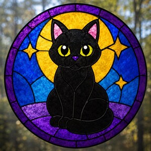 May include: A circular stained glass suncatcher featuring a black cat with large yellow eyes and pink inner ears. The cat is centered against a bright yellow moon, surrounded by a deep blue and purple night sky with small yellow four-pointed stars.