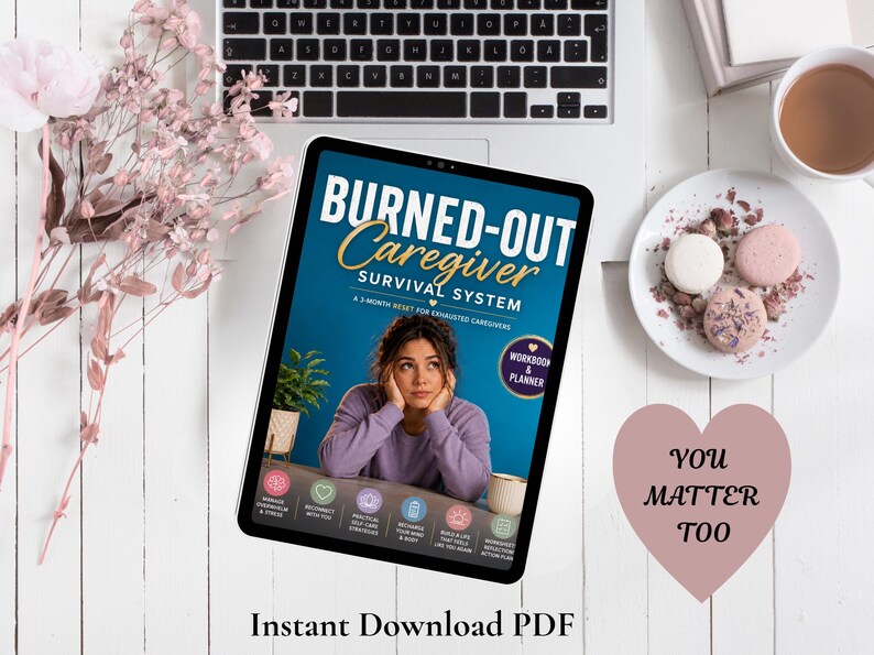 May include: A digital tablet displaying the Burned-Out Caregiver Survival System PDF cover, featuring a person in a lavender sweater, with text including Workbook & Planner, and six circular icons. A heart-shaped note reads You Matter Too.