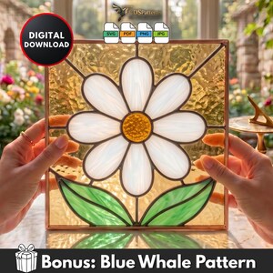 May include: A square stained glass panel featuring a white daisy with a textured yellow centre and two green leaves against a translucent amber background. The design is framed in metal and includes digital file icons for SVG, PDF, PNG, and JPG formats.