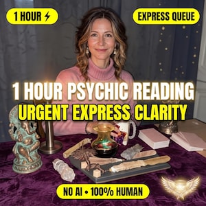 May include: A person wearing a pink turtleneck sweater sits behind a purple cloth covered table. On the table are a bronze Ganesha statue, a glass vase, a wooden wand, a small cube, and stacks of cards. Text reads 1 HOUR PSYCHIC READING URGENT EXPRESS CLARITY.