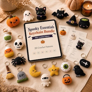 May include: A Spooky Essentials Keychain Bundle PDF crochet pattern tablet display surrounded by various small crocheted Halloween-themed keychains including a pumpkin, ghost, black cat, bat, witch hat, cauldron, skull, candy corn, spider, broom, tombstone, moon, star, mummy, eyeball, raven, and coffin.