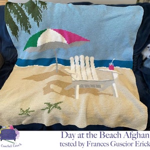 May include: A crocheted beach scene afghan featuring a beach chair, umbrella, and palm trees. The text "Day at the Beach Afghan tested by Frances Guscior Erick" is at the bottom of the image.