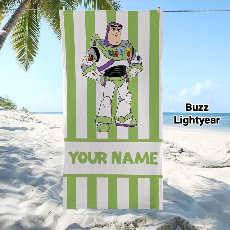 May include: A rectangular beach towel featuring a vertical white and lime green striped pattern. The centre displays a graphic of the character Buzz Lightyear in his space suit. Below the character, a white horizontal band contains the text YOUR NAME.