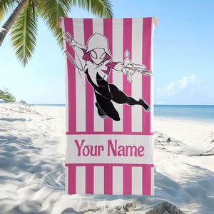 May include: A rectangular beach towel featuring vertical pink and white stripes. The center displays a graphic of a character in a white, black, and pink hooded suit in a dynamic pose. Below the character, the text Your Name is printed in pink.