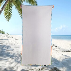 May include: A rectangular beach towel with a large solid white center panel. The vertical edges feature a repeating pattern of light blue and white stripes, while the bottom edge is finished with a horizontal band of orange, green, and black.