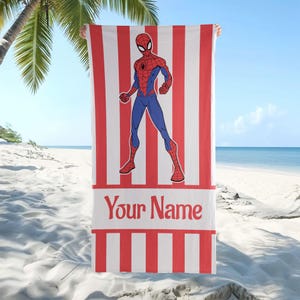May include: A rectangular beach towel featuring a red and white vertical striped pattern. Centered on the towel is a graphic illustration of the superhero Spider-Man in a standing pose. Below the figure is a white horizontal band with the text Your Name.